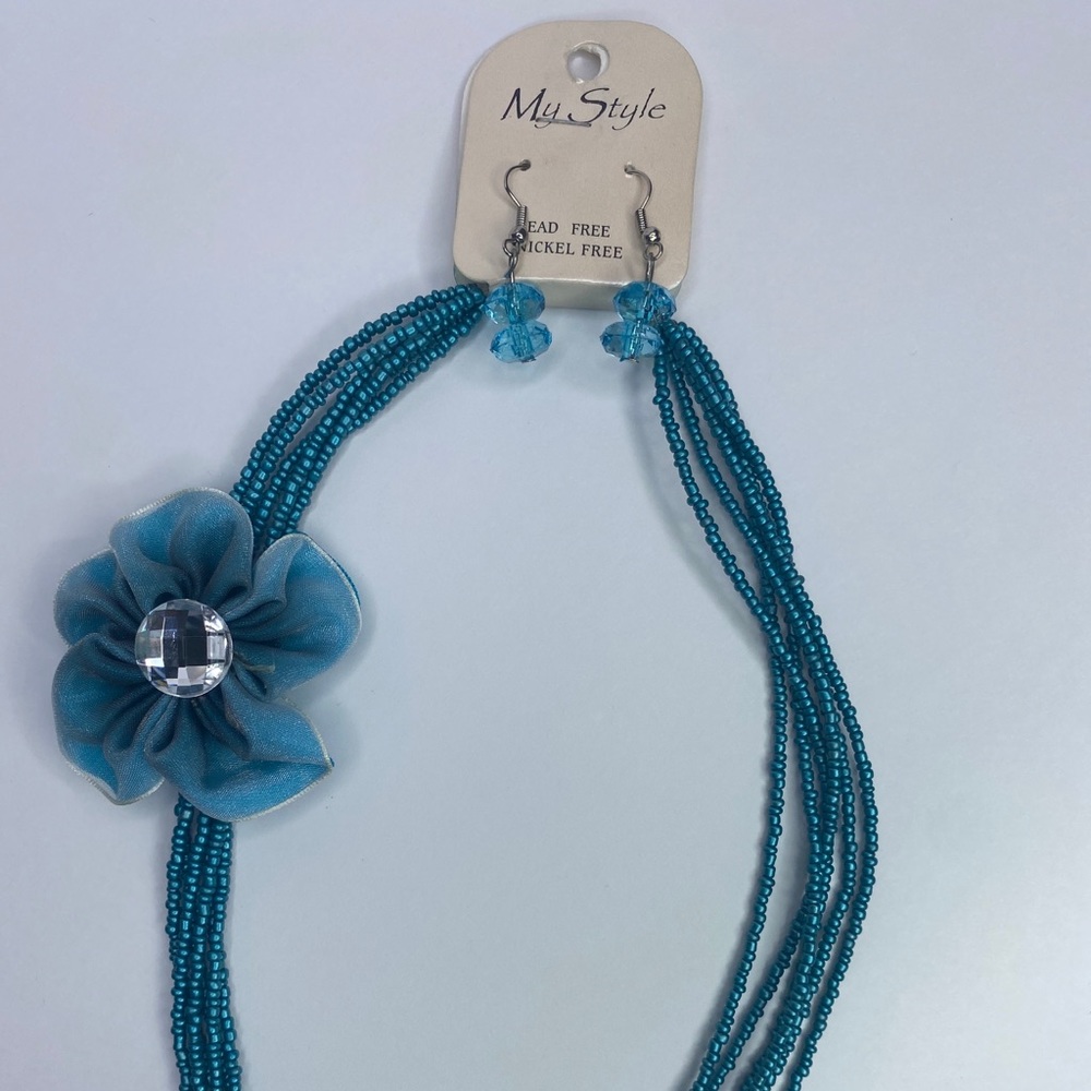 earrings, necklace, and flower pin